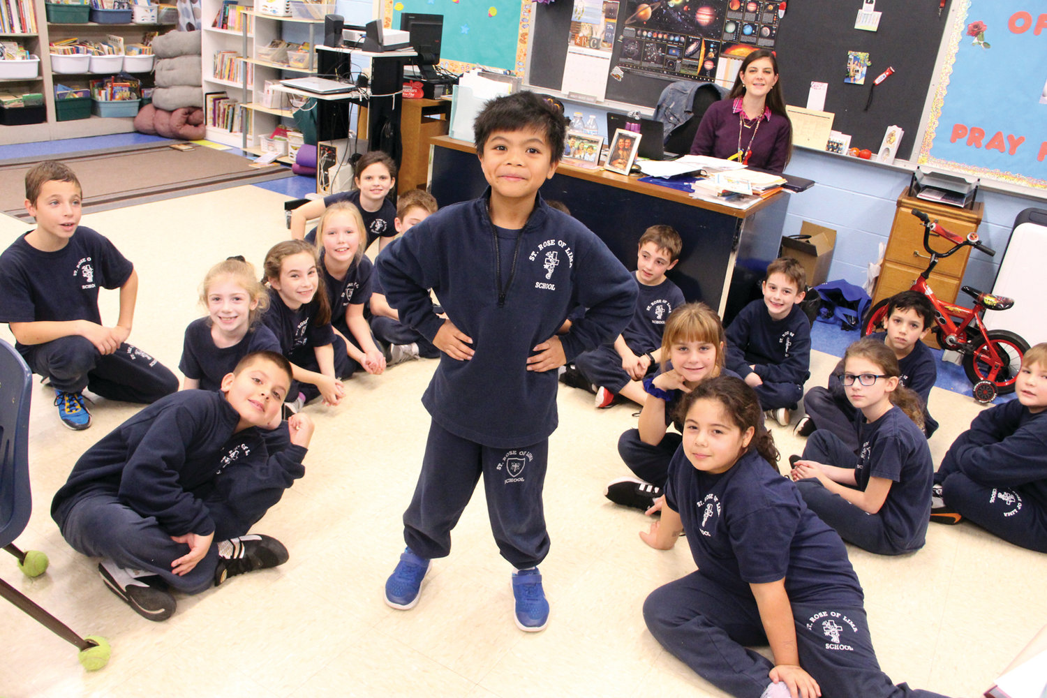 BIG ROLE FOR A 3rd GRADER: Honesto Aguinaldo takes center stage in front of his classmates at St. Rose of Lima School. He is playing the role of Tiny Tim in Trinity Rep’s production of A Christmas Carol.